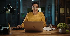 Woman filing taxes for free on a laptop
